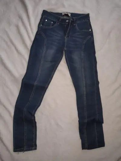 Jeans ajustados de mezclilla azul para mujer - miniatura 1