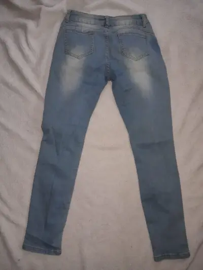 Jeans ajustados de mezclilla azul desgastados - miniatura 1