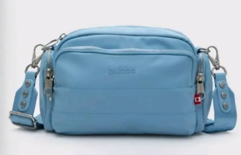 Bolso cruzado azul claro Bubba con múltiples compartimentos - 1