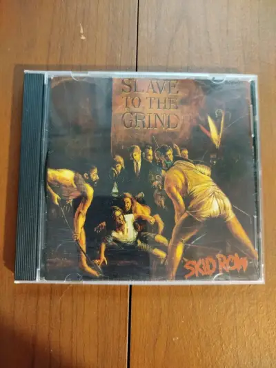 CD Skid Row Slave to the Grind en buen estado - miniatura 1