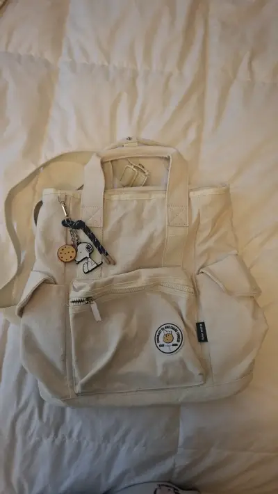 Mochila beige con diseño de Snoopy - miniatura 1
