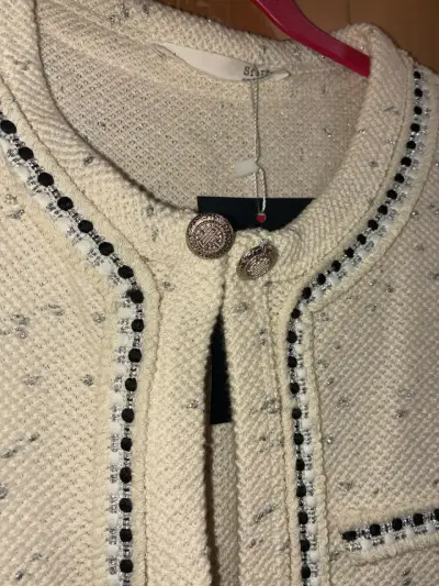 Chaqueta de tweed beige con detalles negros - miniatura 1