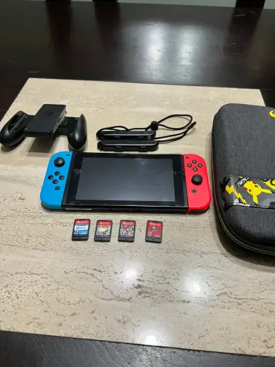 Nintendo Switch con juegos y accesorios - miniatura 1