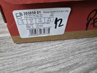 Zapatillas negras para niños Puma Caven 2.0 - miniatura 2
