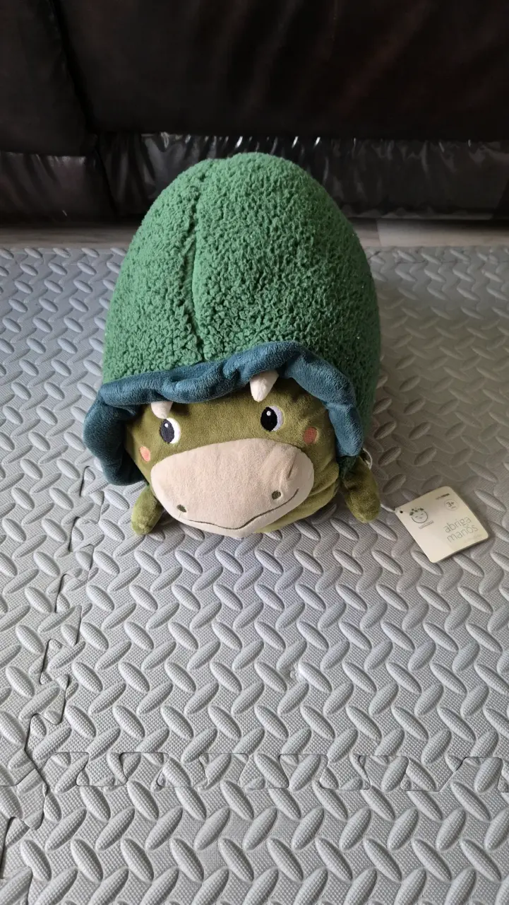 Peluche dinosaurio verde con abriga manos - 1