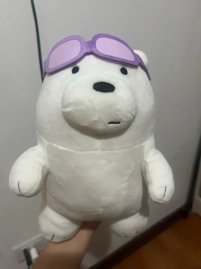Peluche oso polar con gafas moradas