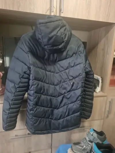 Chaqueta acolchada azul con capucha para hombre - miniatura 1