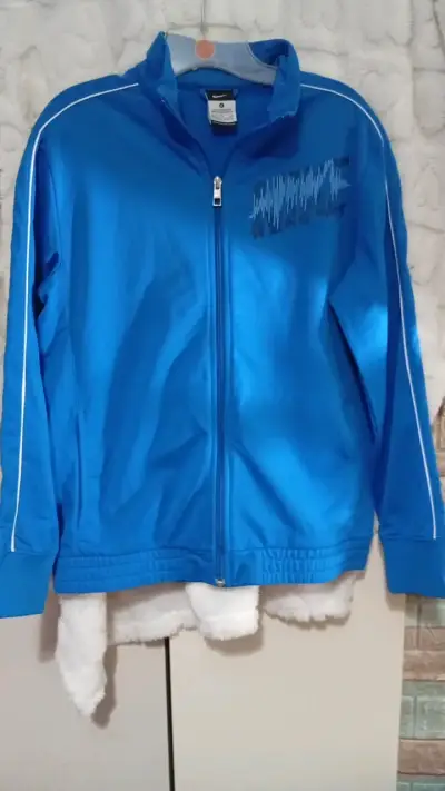 Chaqueta deportiva azul Nike para hombre - miniatura 1