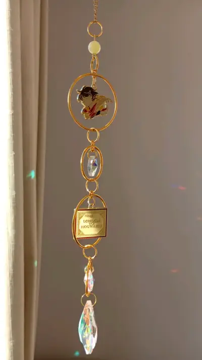 Colgante decorativo dorado con cristales - miniatura 1