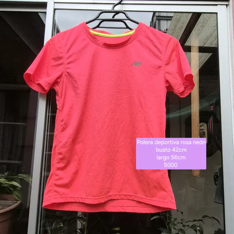 Polera deportiva rosa neón New Balance reflectante - 1