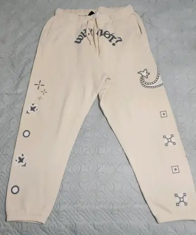 Pantalones deportivos Jordan beige con diseño gráfico - miniatura 1
