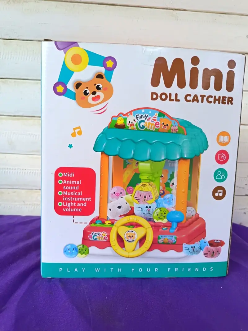 Mini máquina atrapa muñecos con sonidos y luces