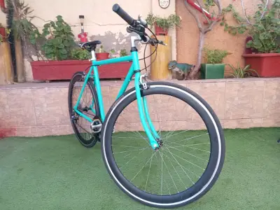 Bicicleta  urbana color turquesa Aro 28 - miniatura 1