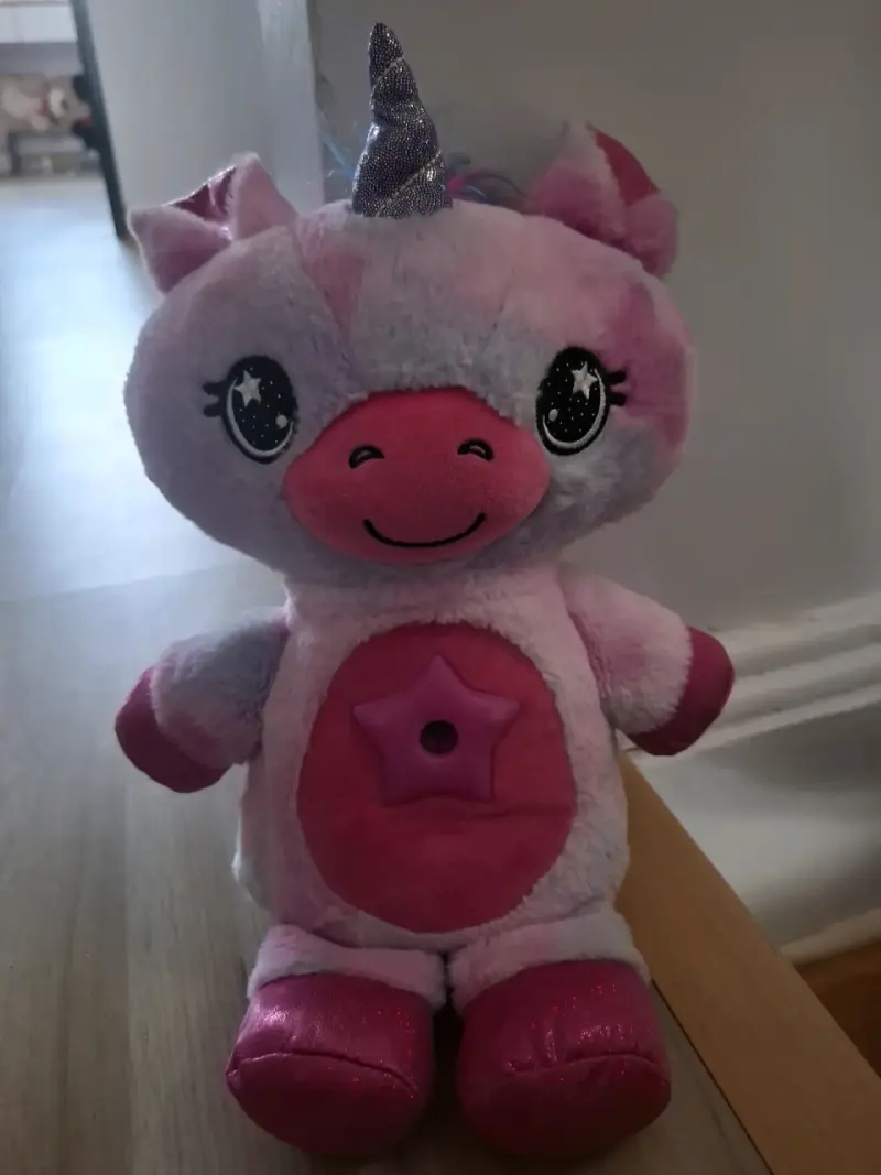 Peluche unicornio rosa con cuerno brillante