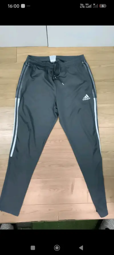 Pantalones deportivos Adidas grises con franjas - miniatura 1