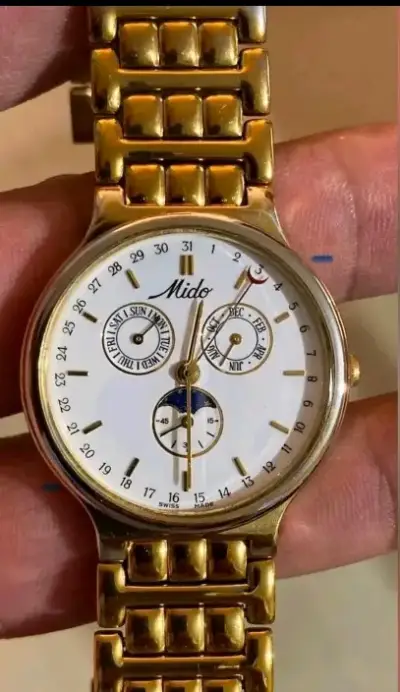 Reloj Mido dorado con calendario y fases lunares - miniatura 1