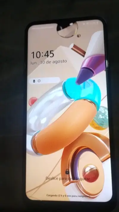 Smartphone LG azul con pantalla táctil - miniatura 1