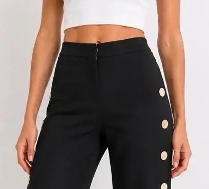Pantalon negro con botones decorativos - 1