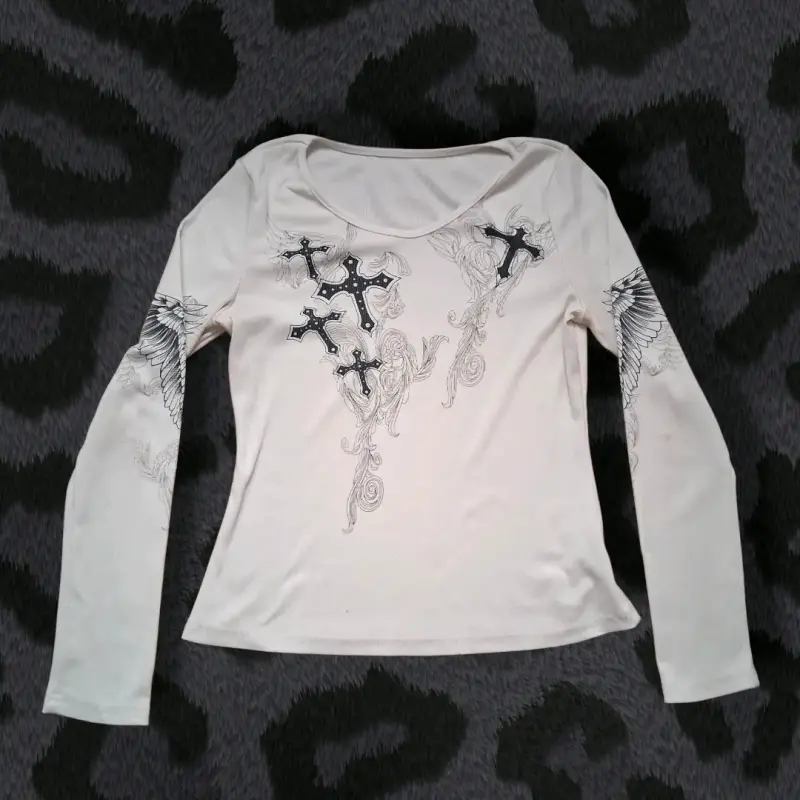 Polera manga larga con diseño de cruces - 1