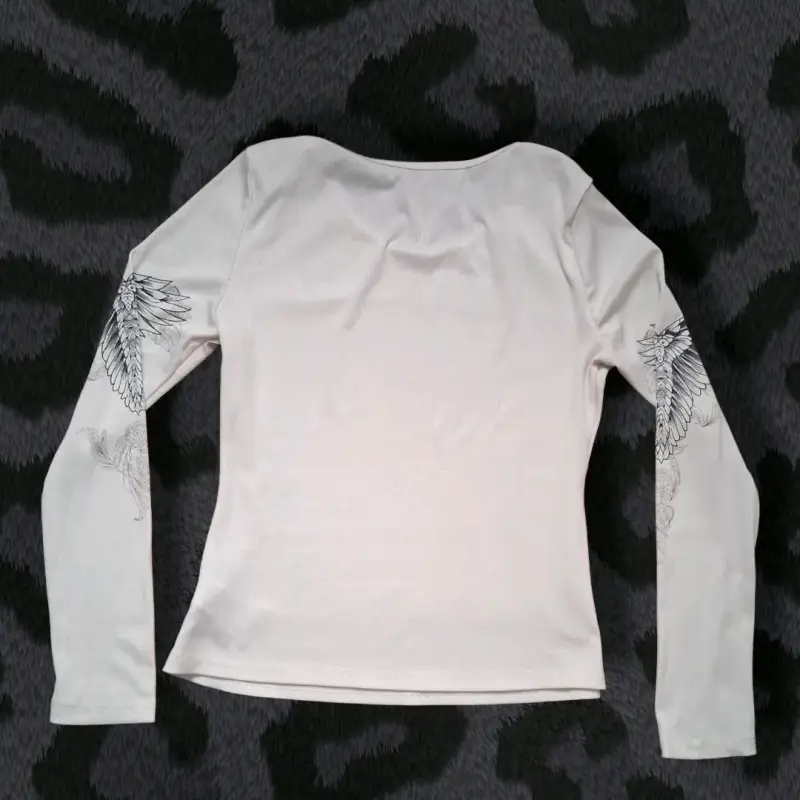 Polera manga larga con diseño de cruces - 2