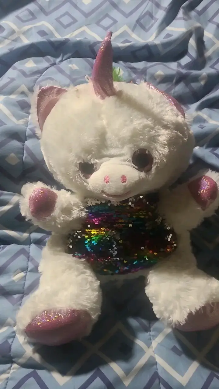 Peluche unicornio con lentejuelas coloridas