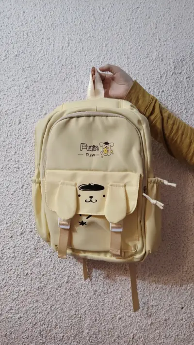 Mochila amarilla Purin con diseño de Pompompurin - miniatura 1
