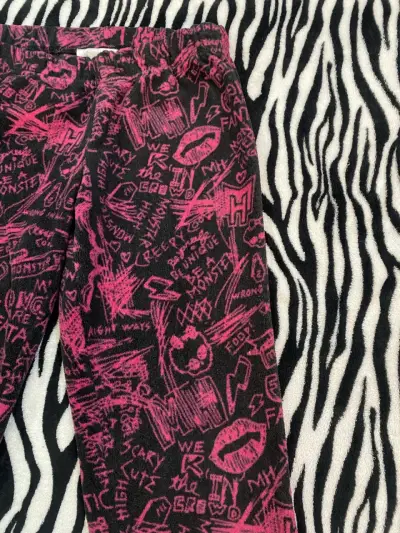 Pantalones estampados negros y rosados para niña - miniatura 3