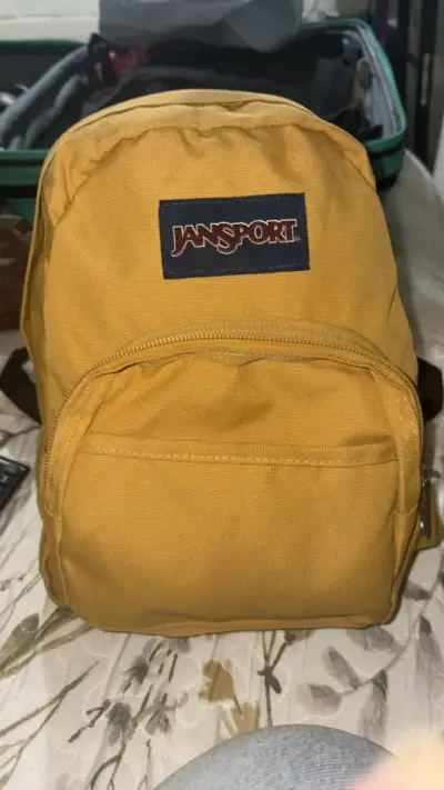 Mochila Jansport Half Pint Mostaza Unisex - miniatura 1
