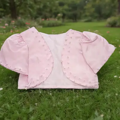 Bolero manga corta rosa con perlas decorativas - miniatura 1