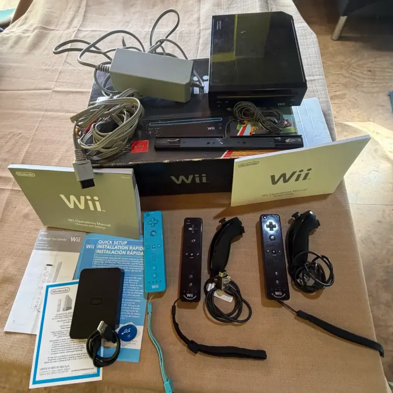 Consola Nintendo Wii con accesorios y manuales
