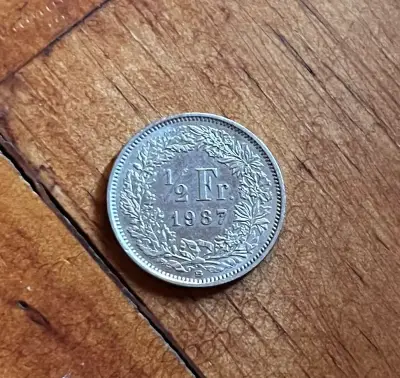 Moneda Suiza 1/2 Franco 1987 - miniatura 1