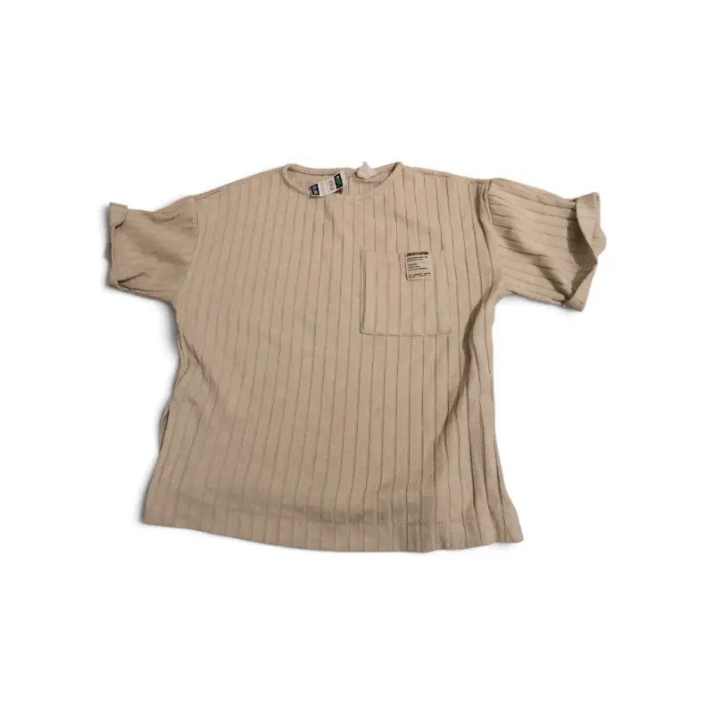 Polera beige de algodón con bolsillo