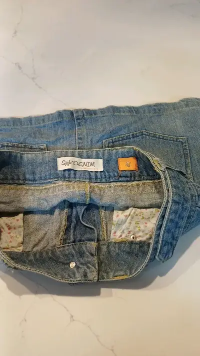 Falda de mezclilla azul con bolsillos - miniatura 3