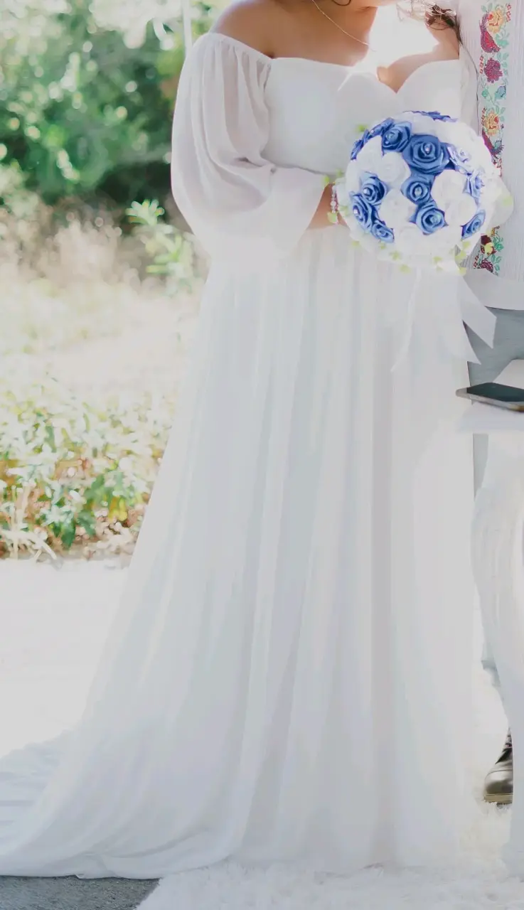 Vestido de novia blanco con mangas largas