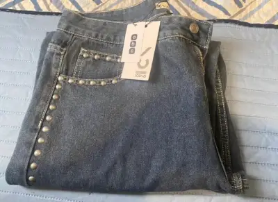 Jeans de mujer con tachas icono - miniatura 1