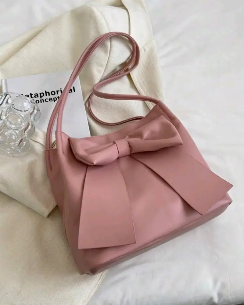 Bolso de hombro rosa con lazo elegante - 1