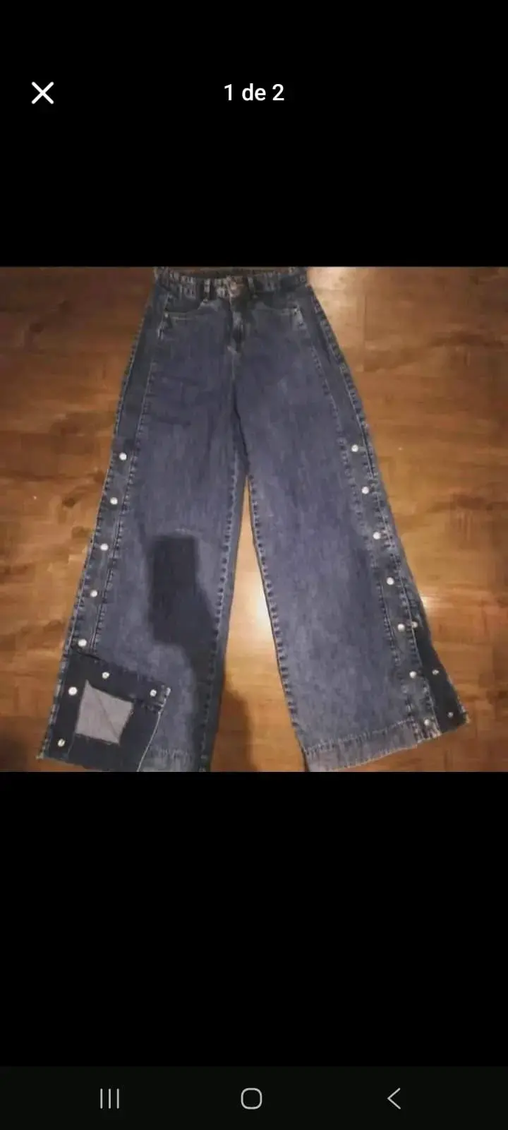 Jeans anchos de mezclilla con botones laterales - 1