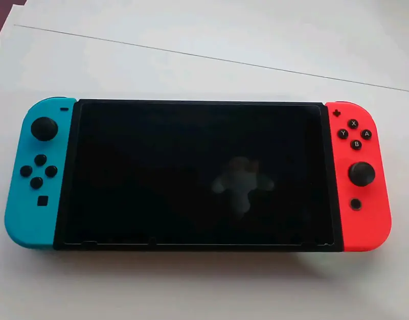 Nintendo Switch v2 con estuche + Sd 32GB + cap.USB - 6
