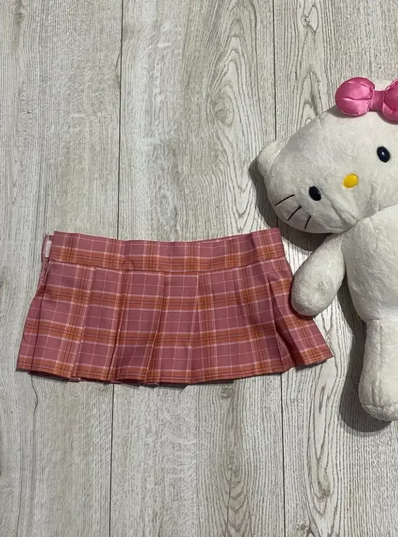 Mini falda escocesa rosada para niña