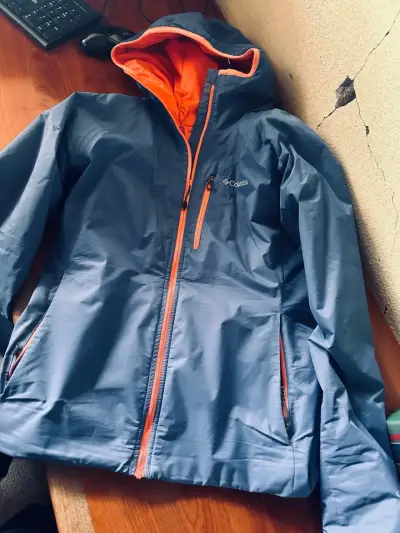 Chaqueta impermeable Columbia azul con capucha - miniatura 1