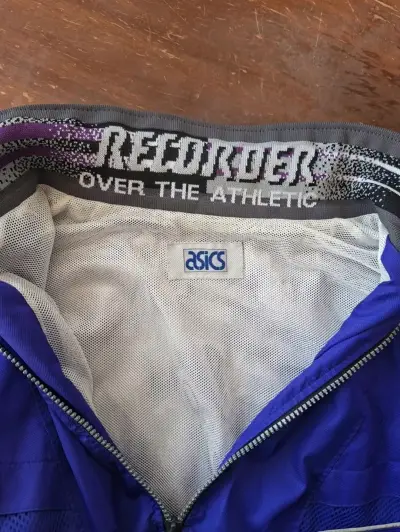 Chaqueta deportiva azul Asics con cierre - miniatura 3