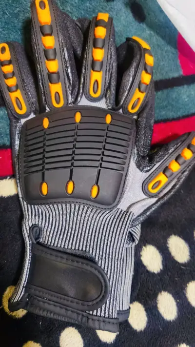 Guantes de protección con refuerzos naranjas - miniatura 1