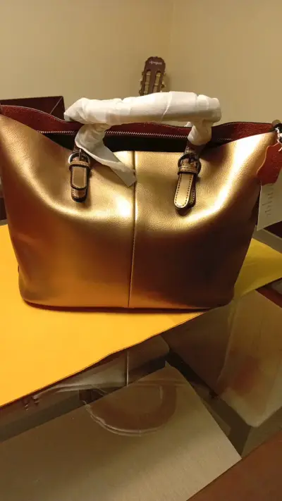 Bolso de mano dorado con interior estampado - miniatura 1