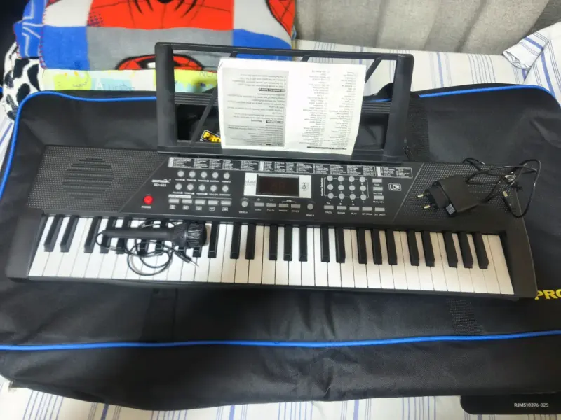 Teclado electrónico con micrófono y adaptador