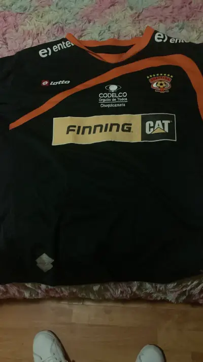 Camiseta de fútbol Cobreloa Lotto negra y naranja - miniatura 1