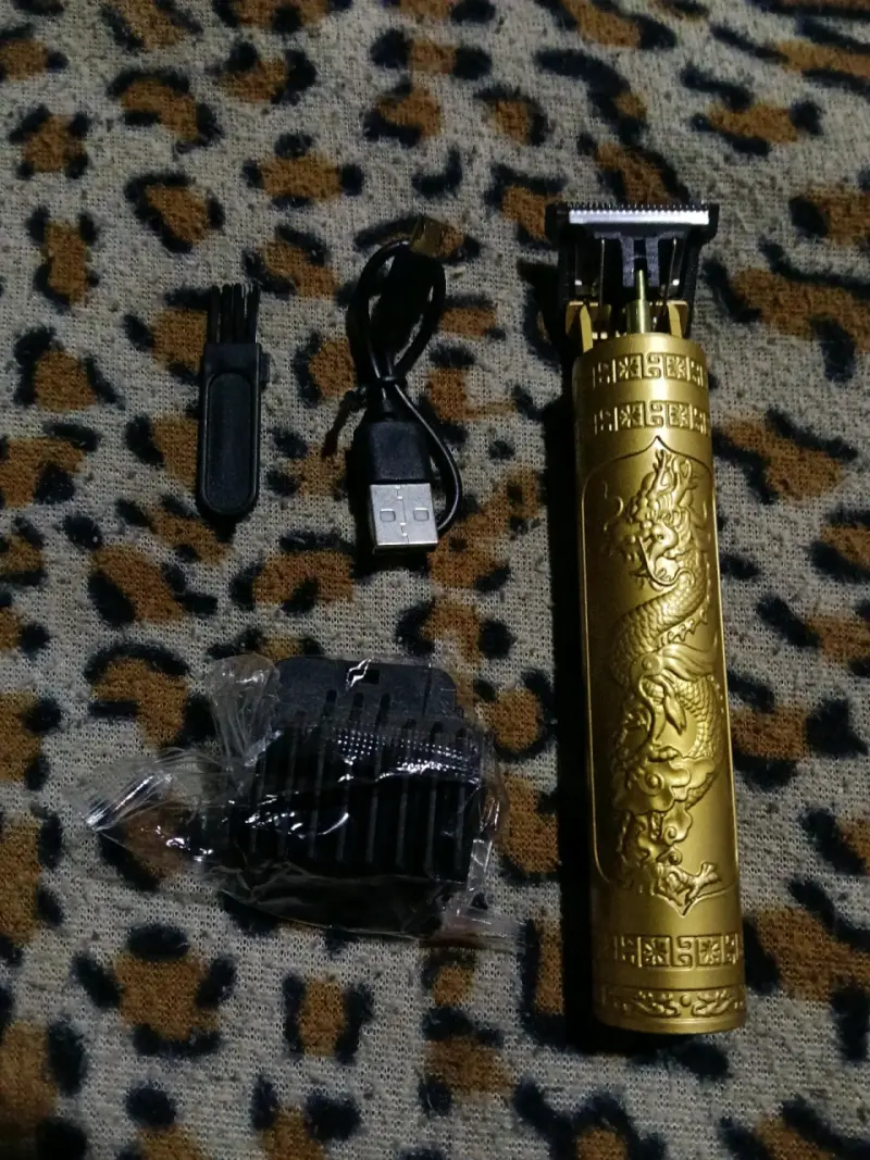 Máquina de cortar pelo recargable dorada