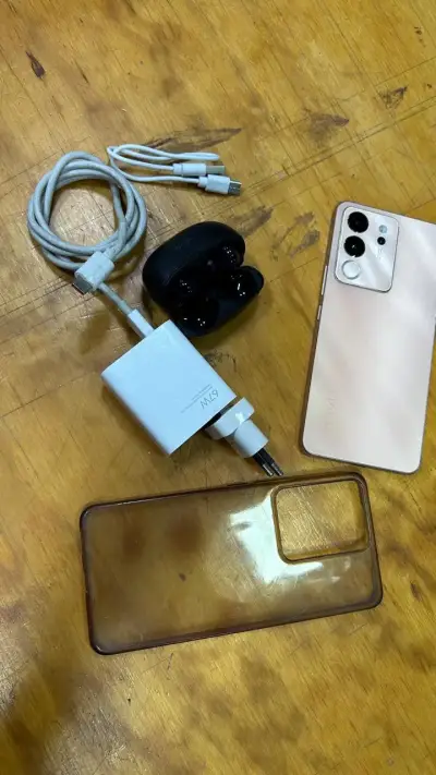Smartphone Vivo con accesorios y audífonos - miniatura 1