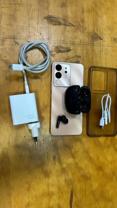 Smartphone Vivo con accesorios y audífonos - miniatura 2