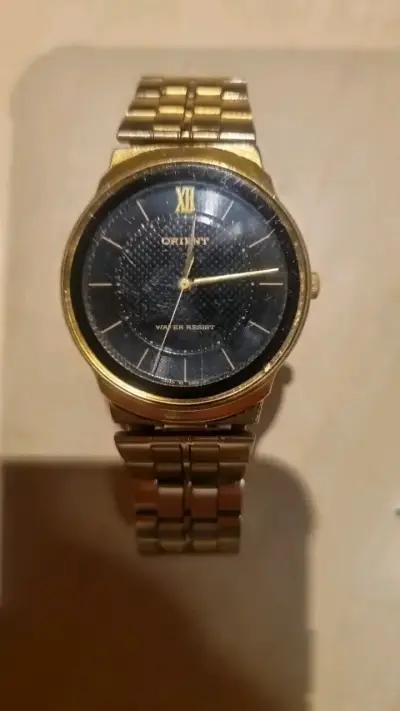 Reloj Orient dorado con pulsera metálica - miniatura 1