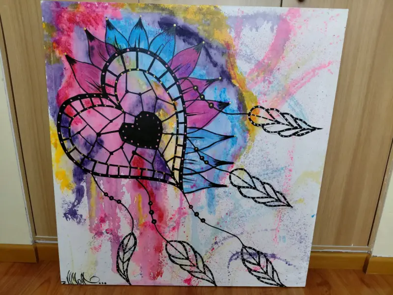 Cuadro decorativo con diseño de corazón y plumas